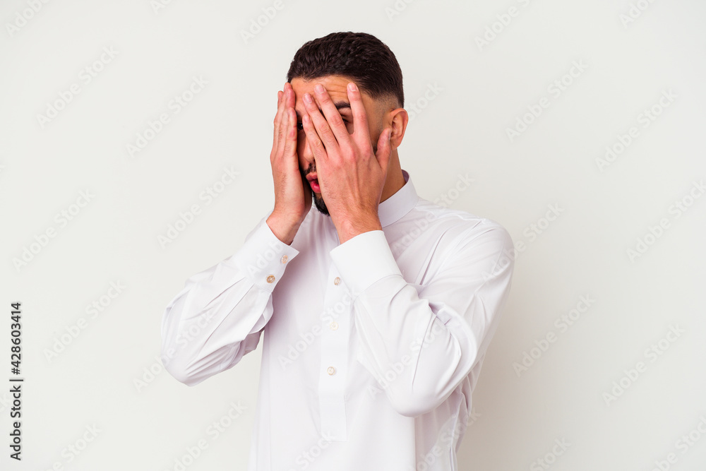 Young arab man wearing typical arab clothes isolated on white background Young arab man wearing typical arab clothes isolated on white background