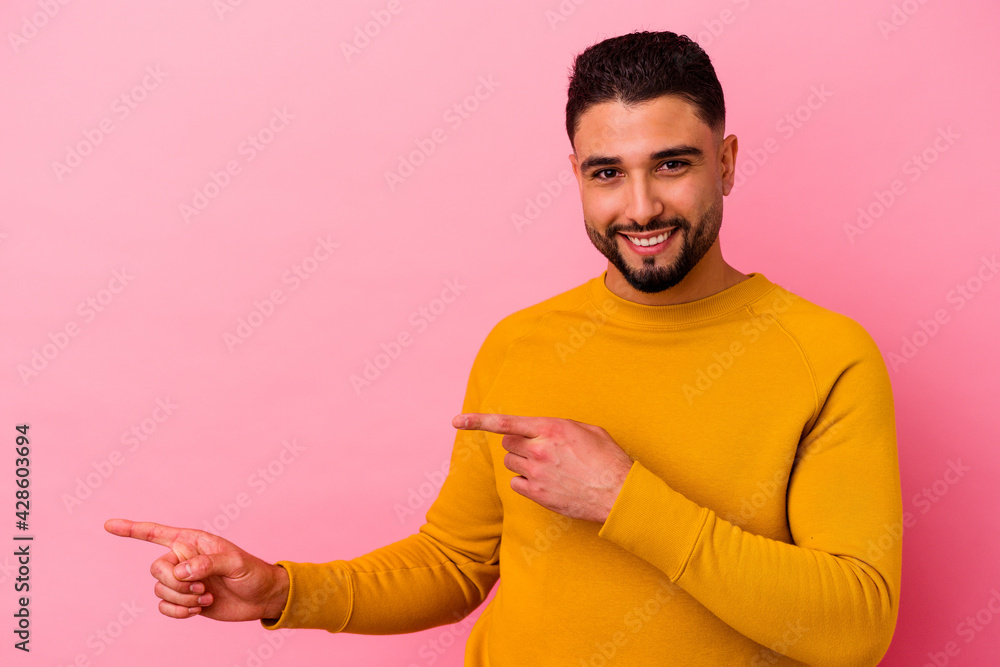 Young mixed race man isolated on pink background Young mixed race man isolated on pink background