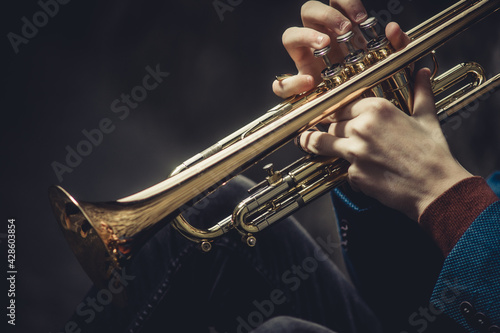 musical trumpet in hands close-up