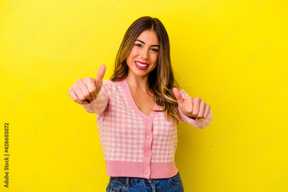 Young caucasian woman isolated on yellow background Young caucasian woman isolated on yellow background