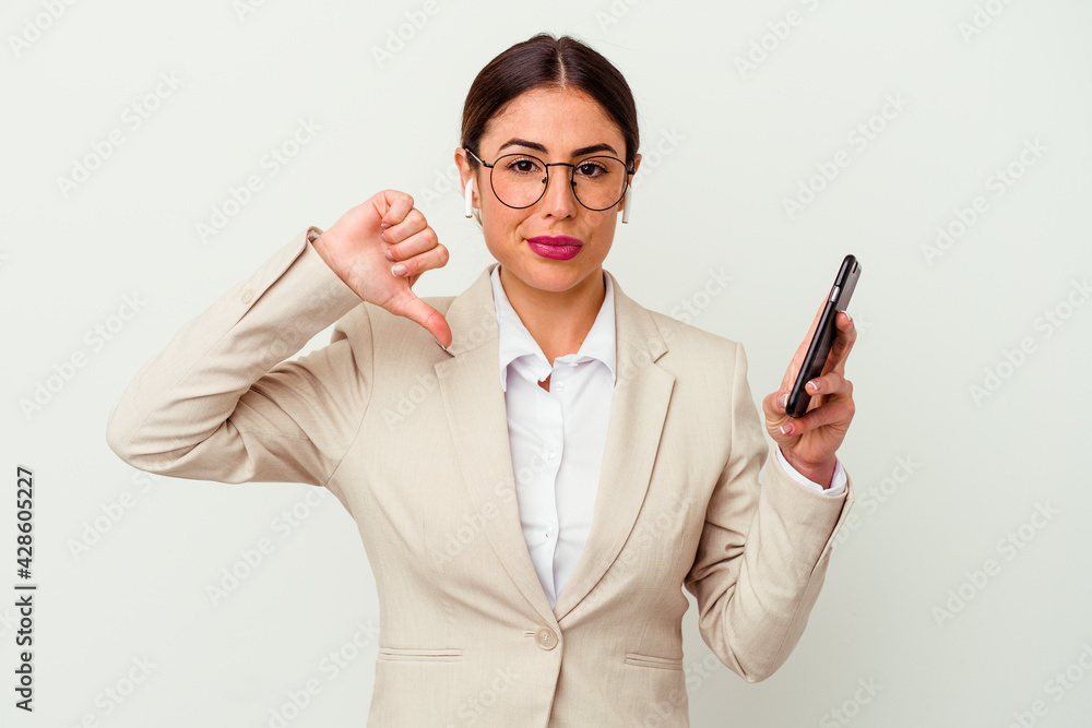 Young business woman holding a mobile phone isolated on white background Young business woman holding a mobile phone isolated on white background