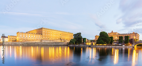 panorama of the palace go the city. castle behind a lake. reflection in lake.