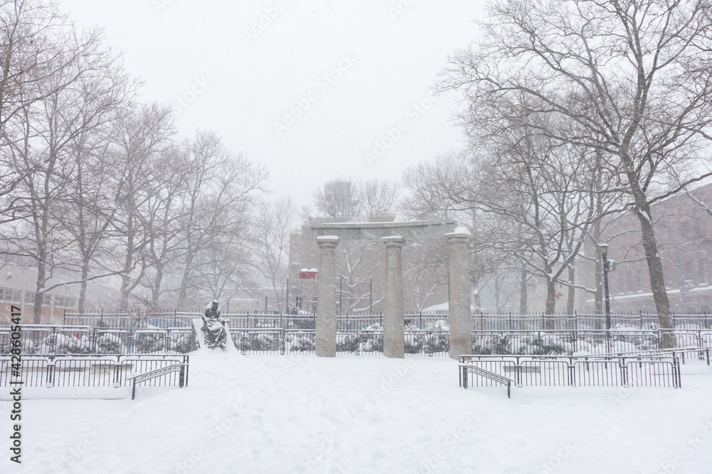 Athens Square Park Covered with Snow during a Massive Snowstorm in Astoria Queens New York