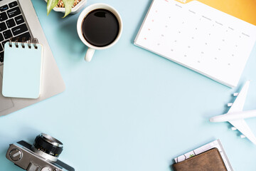 Computer with calendar and travel items on color background with copy space, Vacation planning concept