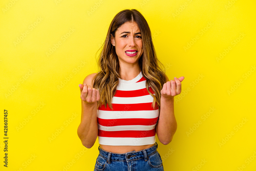 Young caucasian woman isolated on yellow background Young caucasian woman isolated on yellow background