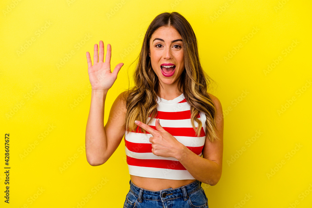 Young caucasian woman isolated on yellow background Young caucasian woman isolated on yellow background