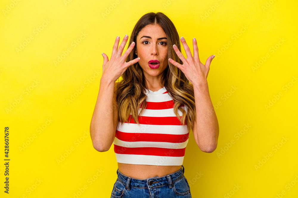 Young caucasian woman isolated on yellow background Young caucasian woman isolated on yellow background