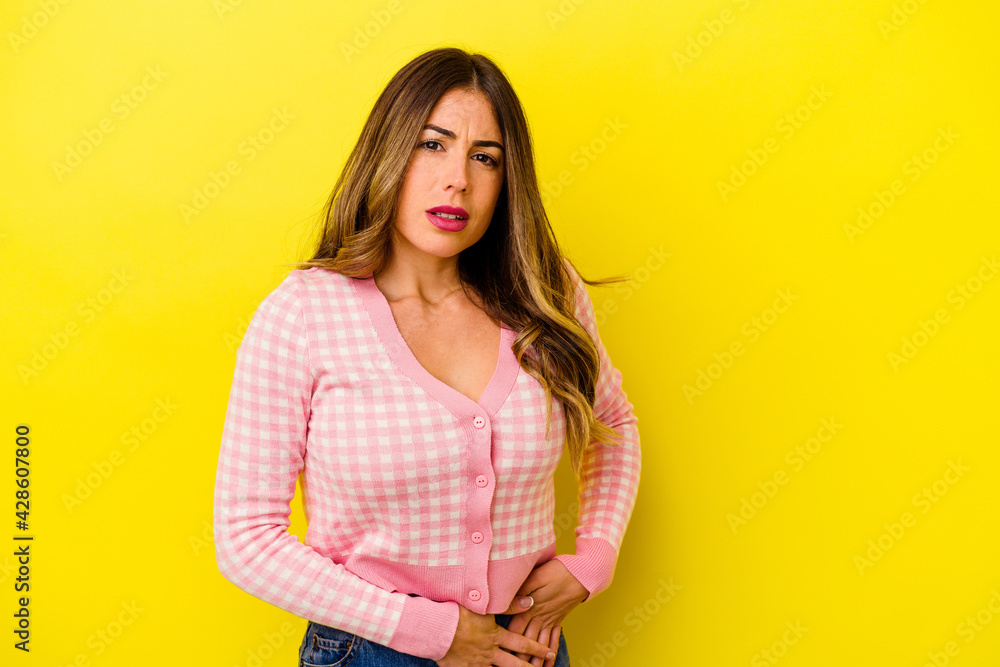 Young caucasian woman isolated on yellow background Young caucasian woman isolated on yellow background