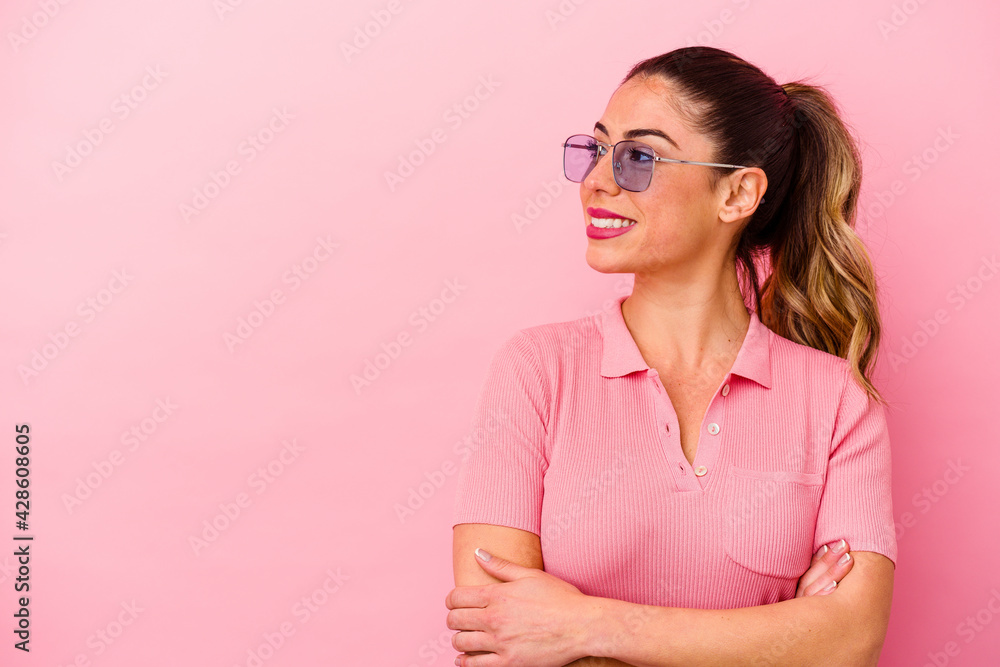 Young caucasian woman isolated on pink background Young caucasian woman isolated on pink background