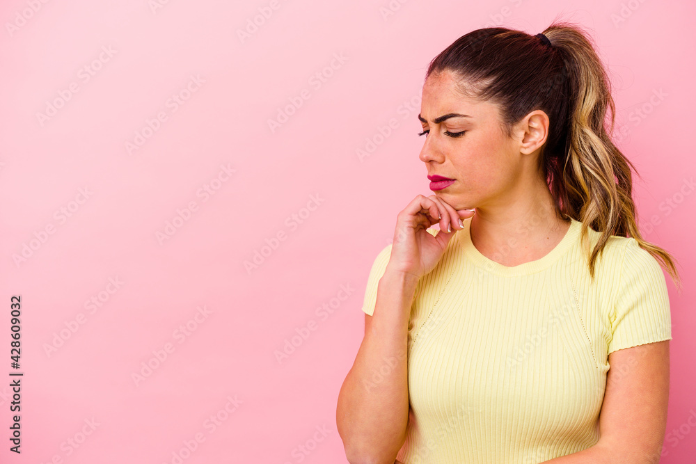 Young caucasian woman isolated on pink background Young caucasian woman isolated on pink background