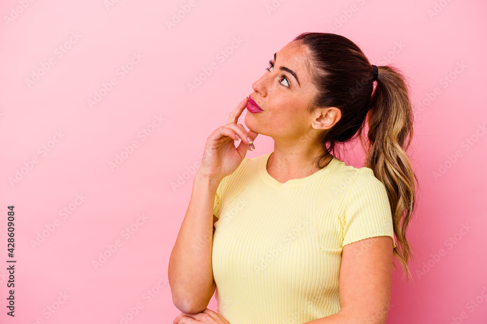 Young caucasian woman isolated on pink background Young caucasian woman isolated on pink background