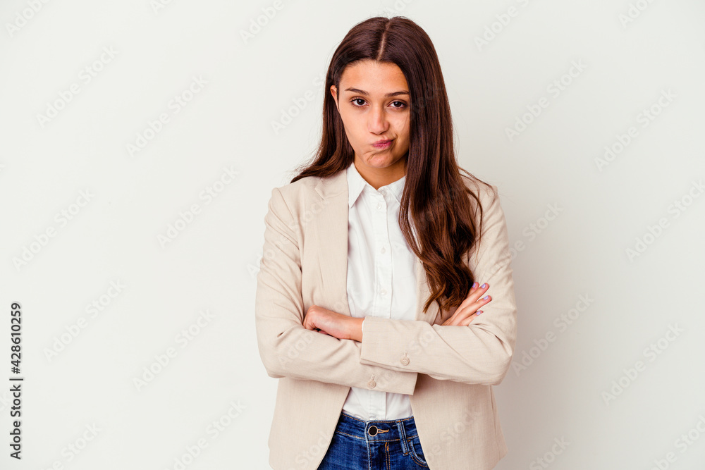 Young Indian business woman isolated on white background frowning face in displeasure, keeps arms folded. Young Indian business woman isolated on white background frowning face in displeasure, keeps arms folded.