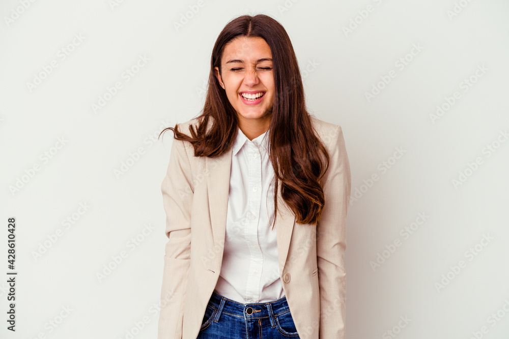Young Indian business woman isolated on white background laughs and closes eyes, feels relaxed and happy. Young Indian business woman isolated on white background laughs and closes eyes, feels relaxed and happy.