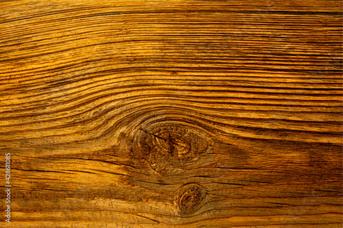 Old dilapidated pine wooden board on the wall.
