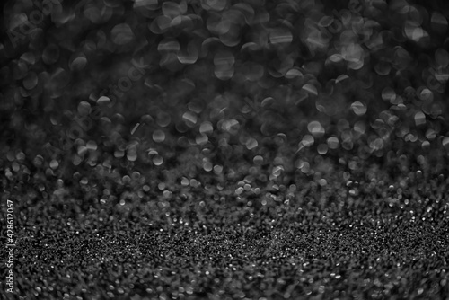 Detailed texture of black glitter dust surface