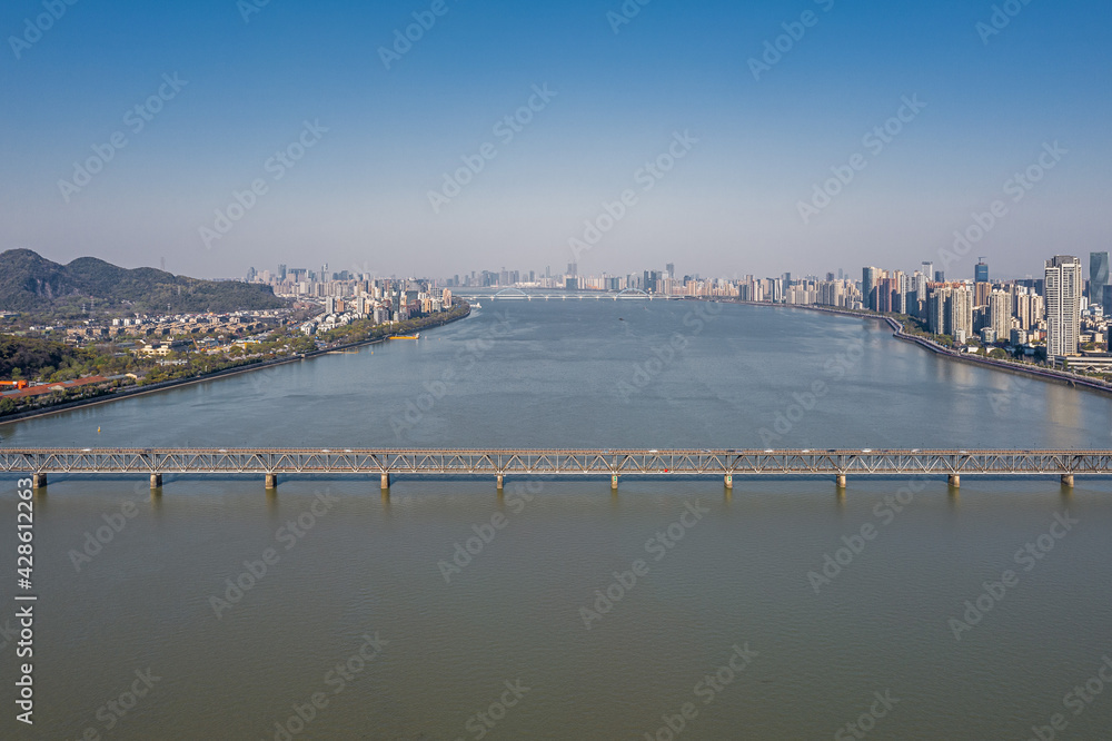 Aerial view of Qiantang River Bridge and modern city skyline in Hangzhou, China