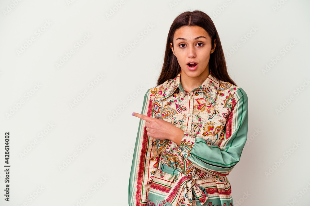 Young Indian woman isolated on white background pointing to the side Young Indian woman isolated on white background pointing to the side