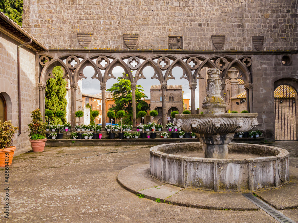 Fototapeta premium Viterbo, impressive view of the Loggia of the Papal Palace and its ancient fountain, Lazio, central Italy 