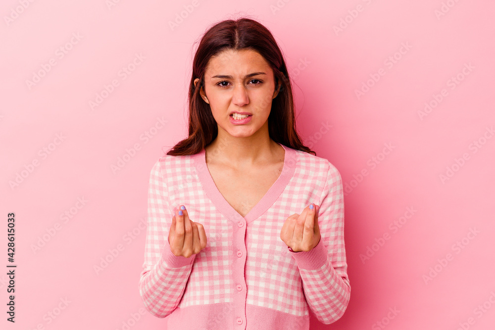 Young Indian woman isolated on pink background showing that she has no money. Young Indian woman isolated on pink background showing that she has no money.