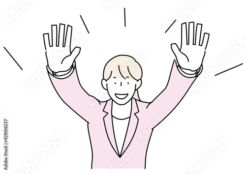 両手を上げるスーツの女性　正面