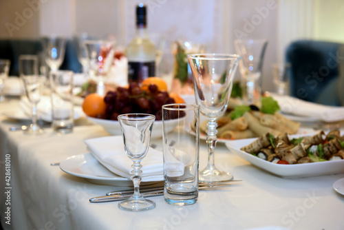 Festive table served with food dishes. Traditions of a festive luxury feast.