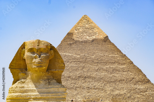 The Sphynx and the Pyramid of Keops at the Giza plateau , near Cairo 