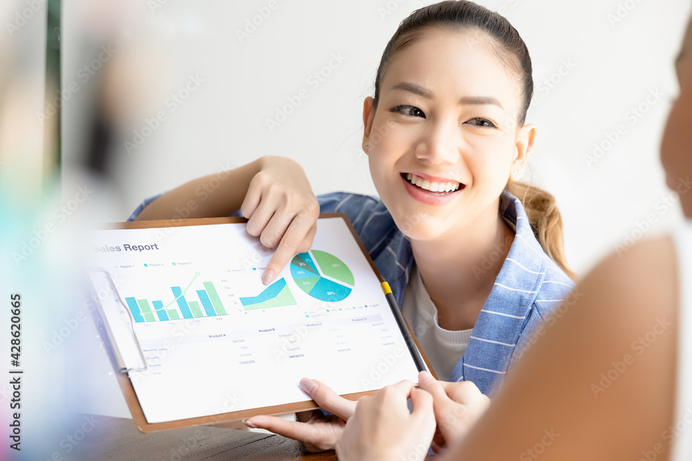 Group of asian partner small business smiling happy and confident. Team working brainstorm project document sheet paperwork together with smile. Business startup company teamwork on meeting in office. Group of asian partner small business smiling happy and confident. Team working brainstorm project document sheet paperwork together with smile. Business startup company teamwork on meeting in office.