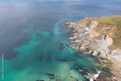 Aerial photograph of Gunwalloe Church Cove and Dollar Cove nearthe Lizard, Cornwall, England.