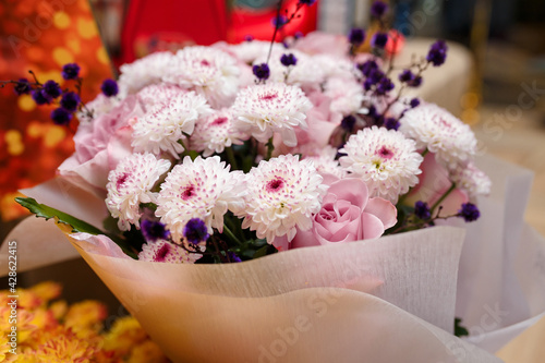 soft focused close up shot of beautiful pink mums flowers bouquet. Valentines day, birthday, anniversary, wedding present.