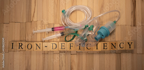 Iron deficiency. It was prepared from wooden cubes. White background.