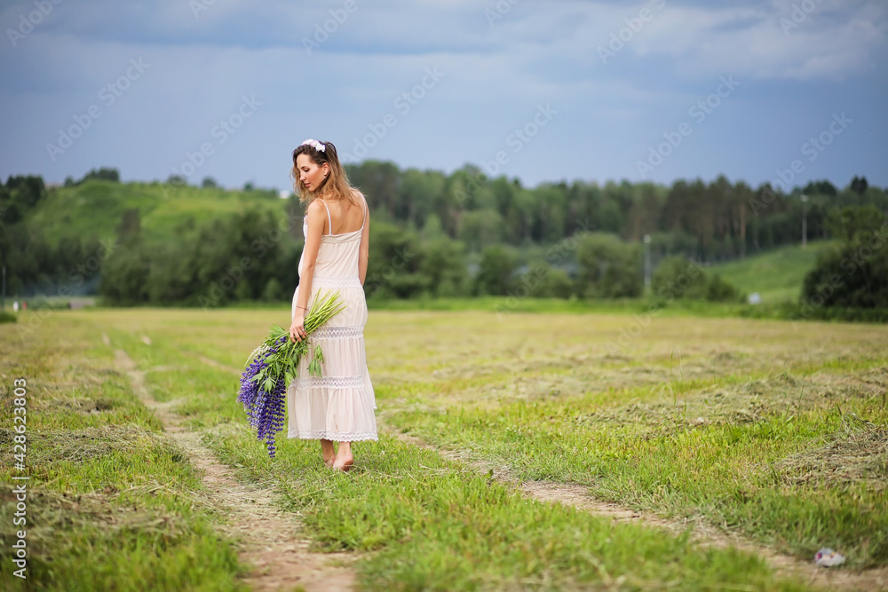 Girl with a bouquet of blue flowers Girl with a bouquet of blue flowers