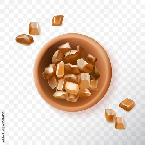 Brown sugar crystals in ceramic bowl, raw cane sugar top view