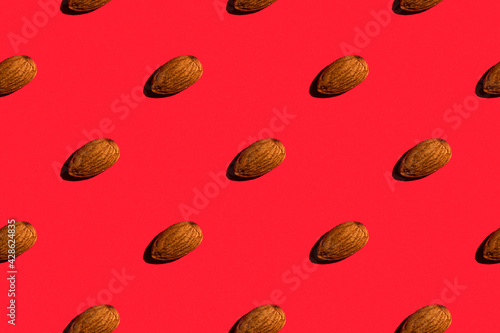 Background from pistachios. Trendy sunny pattern of pistachios on a bright yellow background. Colorful pattern. View from above