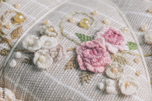 Flowers embroidery. The fabric is embroidered with flowers. Close-up. High quality photo