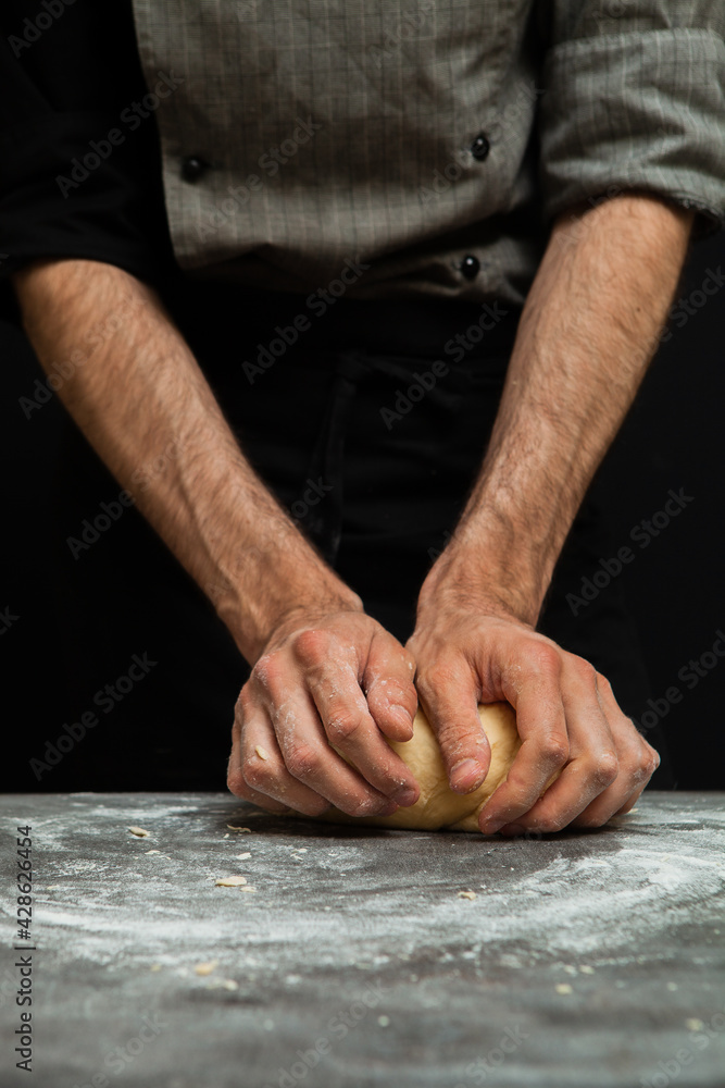 baker kneading dough