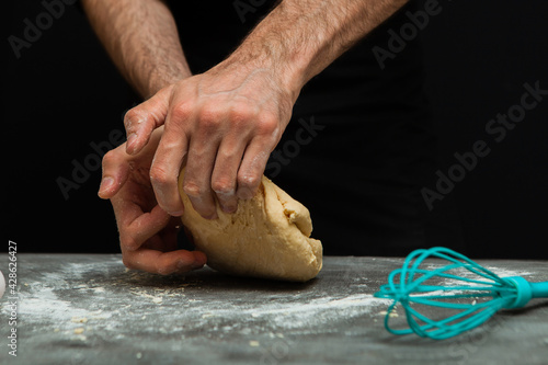 hands kneading dough