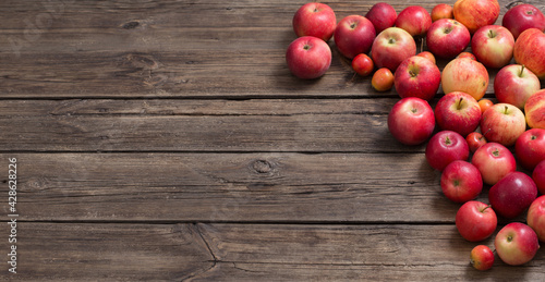 red apples on old wooden background