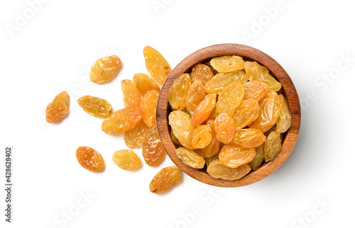 Flat lay of Yellow Raisins in wooden bowl isolated on white background. Clipping path photo