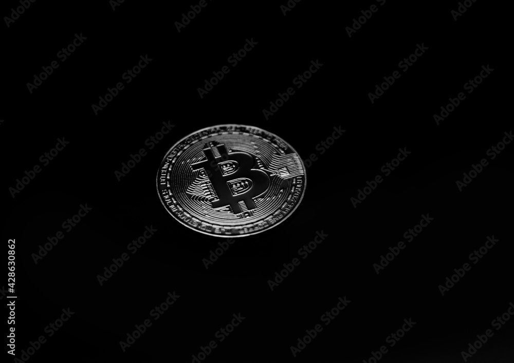 Gold bitcoin coin against the background of the cryptocurrency rate index chart Gold bitcoin coin against the background of the cryptocurrency rate index chart