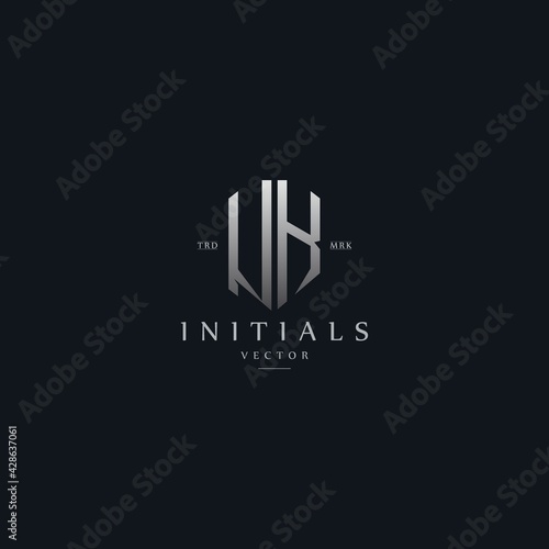 classy UK vintage metal monogram logo. elegant silver initials icon premium vector design template