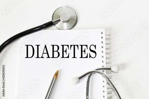 medical text DIABETES on the card. white background, stethoscope, medicine. medical concept