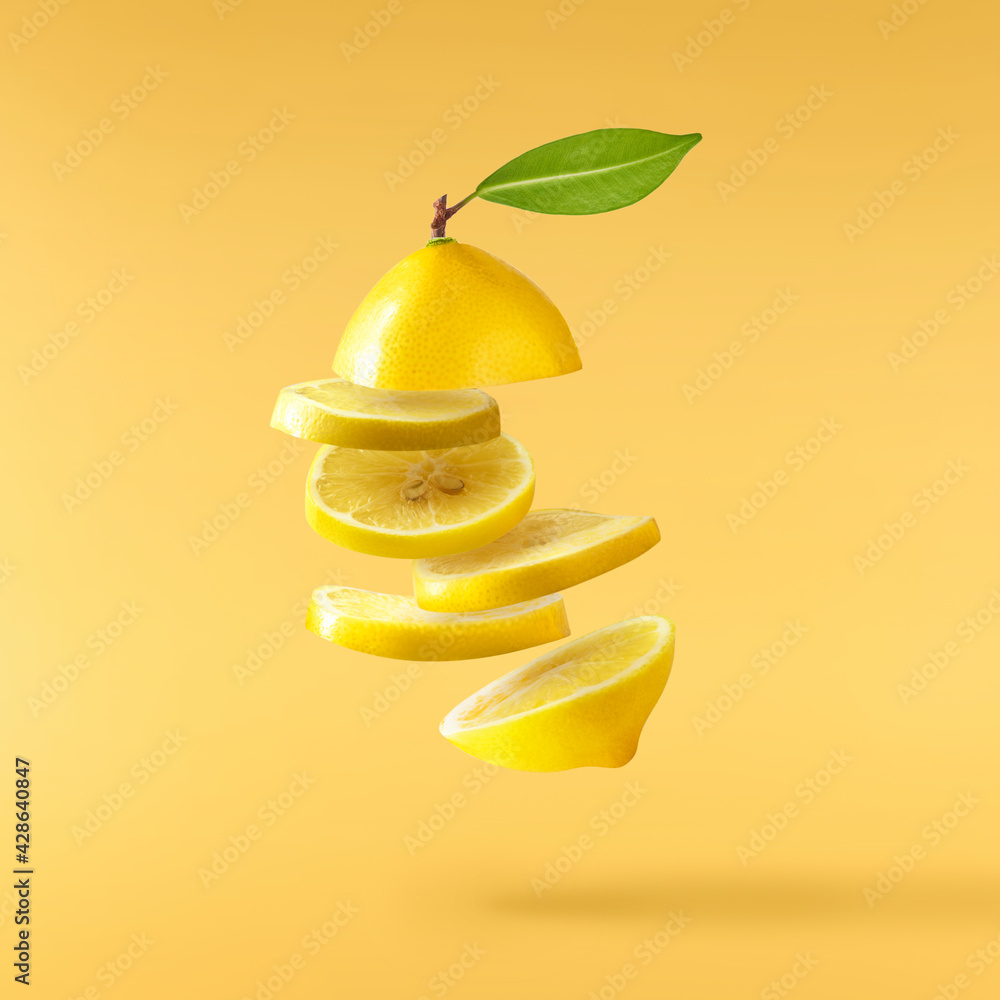 creative image with fresh lemons falling in the air, zero gravity food conception creative image with fresh lemons falling in the air, zero gravity food conception