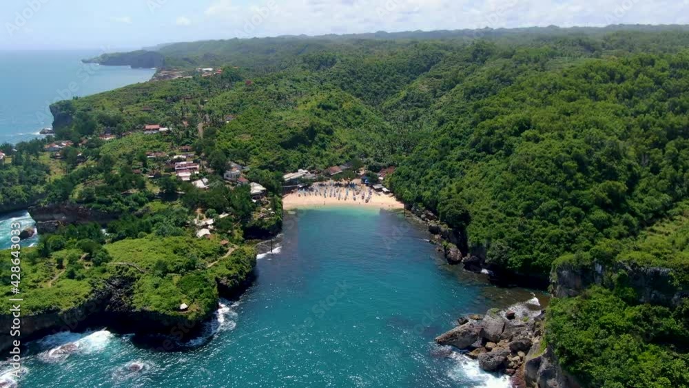 Tranquil hidden tropical cove, Gesing Beach Indonesia, aerial panorama Tranquil hidden tropical cove, Gesing Beach Indonesia, aerial panorama