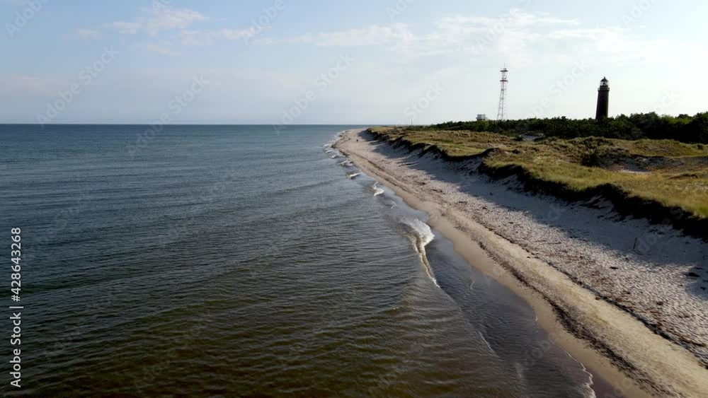 Low aerial drone shot along the beach in Darß Forest in northern Germany. Low aerial drone shot along the beach in Darß Forest in northern Germany.