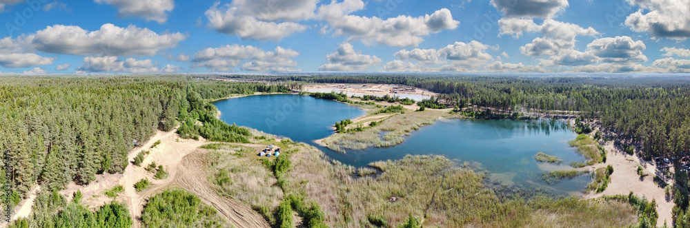 two blue lakes and green pine forest aerial view