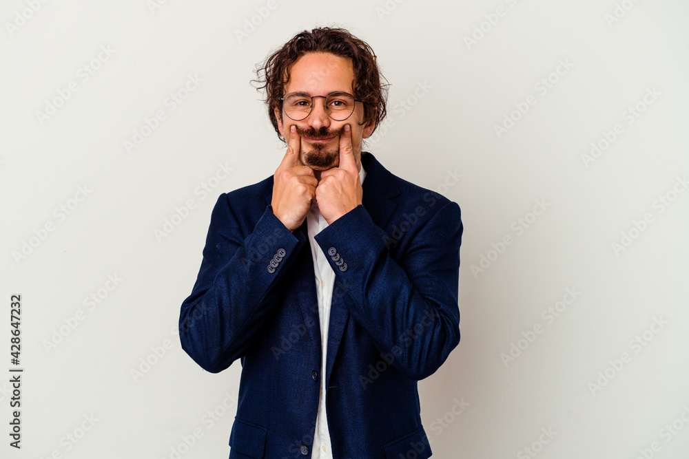 Young business man isolated on white background doubting between two options. Young business man isolated on white background doubting between two options.