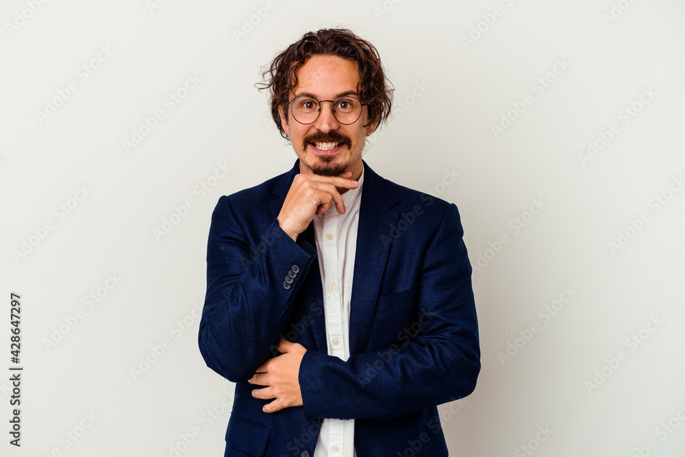 Young business man isolated on white background smiling happy and confident, touching chin with hand. Young business man isolated on white background smiling happy and confident, touching chin with hand.