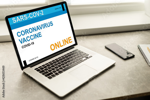 online health appointment, booking or reserve coronavirus or covid-19 vaccine in concept social distance healthcare in quanrantine people at home using laptop computer.