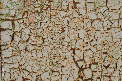 Texture in the form of a wall with old cracked paint. 