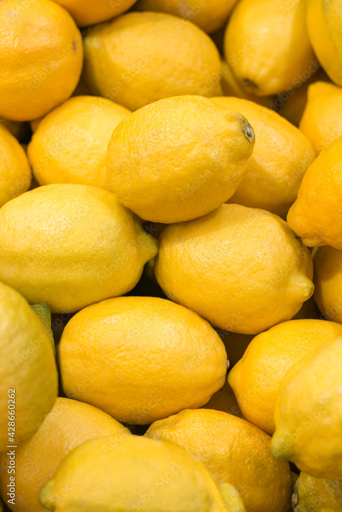 Ripe whole lemons closeup background wallpaper